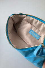 Twinset Clutch aus blauer Taftseide mit großer Schleife und Reißverschluss, Damentasche mit Borse-Logo