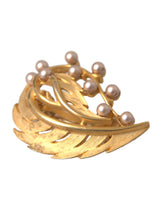 Broche à cheveux Dolce & Gabbana en laiton doré ornée de feuilles