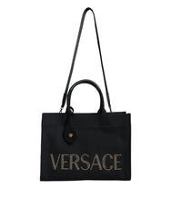 Sac cabas bandoulière Versace en toile et cuir noir avec poignée supérieure et logo