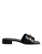 Versace Slipper aus schwarzem Leder mit Logo-Plakette