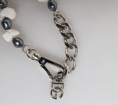 Bracelet Dolce & Gabbana en laiton argenté avec pendentif coquillage et logo DG orné de perles