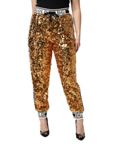 Dolce & Gabbana Jogginghose mit Paillettenbesatz und DG-Logo in Metallic-Gold