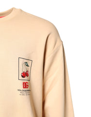 Dolce & Gabbana Pullover in Beige mit Kirschmuster und Rundhalsausschnitt