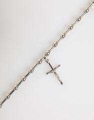 Collier pendentif croix religieuse Dolce & Gabbana en laiton argenté et chaîne.
