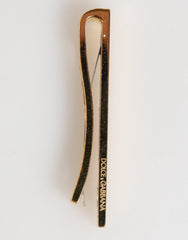 Pince à cravate Dolce & Gabbana en laiton doré avec logo, accessoire pour homme.