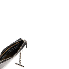 Rear view of the Alexander McQueen black calfskin clutch highlighting the smooth, premium leather texture.