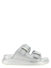 Alexander McQueen silver rubber slides featuring a wide logo-embossed strap and ergonomic footbed for refined comfort.