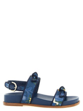 Alexandre Birman blue cowhide flat sandals featuring signature knotted straps and a refined minimalist silhouette.