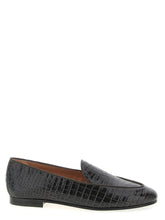 Aquazzura black calfskin slip-on loafers featuring a sleek almond toe and minimalist silhouette for refined daily wear.