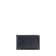 Interior view of the Balenciaga black leather wallet showing organized card slots and precise Italian craftsmanship.