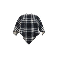 Bočný pohľad na šál Burberry Oves Aries v sivej vlne, ktorý ukazuje jemný plynulý strih a prvotriednu textíliu.