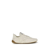 Chloé beige fabric athletic sneakers featuring a chunky sculpted sole and signature logo ribbon pull tabs.
