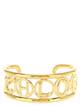 Chloé gold brass cuff bracelet featuring a minimalist architectural design with a polished luxury finish.