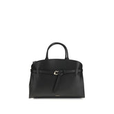 Coccinelle black calf leather Bos Taurus handbag with structured top handle and gold-tone hardware front view.