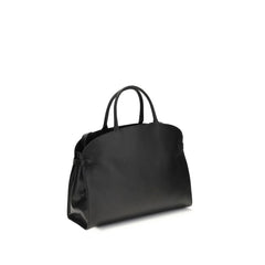 Rear view of the Coccinelle black calfskin handbag highlighting the smooth leather finish and tonal stitching.