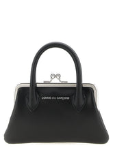 Front view of the Comme Des Garçons black cowhide cardholder featuring a minimalist design and smooth leather finish.