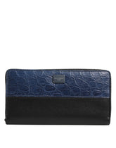 Dolce & Gabbana men's continental clutch wallet in black and blue caiman and calfskin leather, front view.