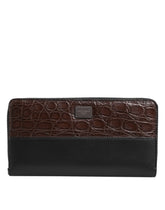 Dolce & Gabbana men's continental clutch wallet in black and brown exotic leather with a structured rectangular silhouette.