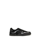 Dolce & Gabbana black calf leather Bos Taurus sneakers, front view showing sleek low-top silhouette and tonal laces.