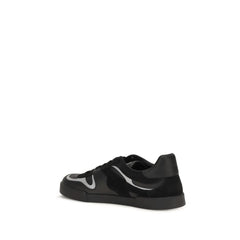 Dolce & Gabbana mustade nahast tossude tagaview, mis rõhutab tugevdatud kandikujõudu ja minimalistlikku disaini.