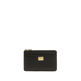 Dolce & Gabbana black calf leather Bos Taurus wallet with gold-tone logo plaque and refined pebbled texture.