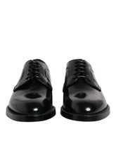 Dolce & Gabbana black calf leather lace-up Derby shoes in a classic formal silhouette for men.