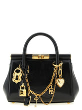 Framifrån vy av en Dolce & Gabbana svart läderväska i kalvskinn med strukturerat handtag och guldtonade detaljer.