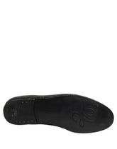 Dolce & Gabbana men's black leather loafers with intricate crystal embellishments in a classic evening silhouette.