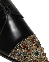 Dolce & Gabbana black leather embellished Derby dress shoes, front view showcasing refined formal silhouette.