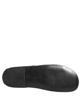 Dolce & Gabbana men's black woven fabric slides featuring a sophisticated textured strap and flat profile.