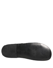 Dolce & Gabbana men's black woven fabric slides featuring a sophisticated textured strap and flat profile.