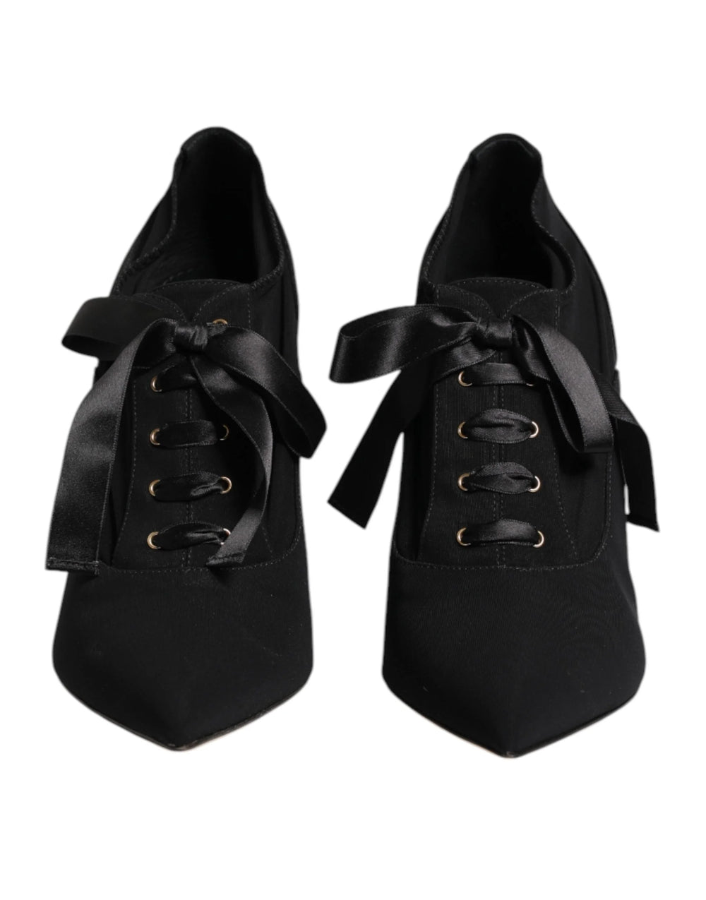 Dolce & Gabbana black lace-up stiletto pumps featuring a pointed toe and elegant wrap-around ankle ties.