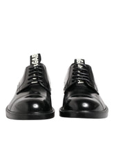 Dolce & Gabbana schwarze formelle Schnürdressschuhe aus Kalbleder für Herren, Frontansicht mit polierter Oberfläche.