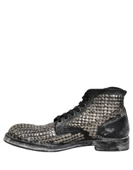 Close-up of the premium black leather grain and polished silver studs on these luxury Dolce & Gabbana ankle boots.