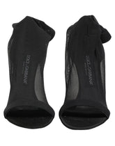 Dolce & Gabbana black nylon mesh sock-style ankle boots featuring a sleek pointed toe and slim stiletto heel.