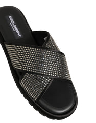 Dolce & Gabbana men's black leather slide sandals with criss-cross straps and tonal strass crystal embellishments.