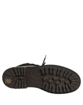 Dolce & Gabbana black leather trekking boots with fur trim and lace-up front, showcasing a rugged luxury silhouette.