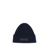 Front view of a Dolce & Gabbana men's Oves Aries beanie in deep blue wool with a classic ribbed knit texture.