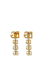 Sivukuva Dolce & Gabbanan kultan sävyisistä korvakoruista, jossa näkyy hienostunut metallinhohtoisuus ja rakenteellinen syvyys.