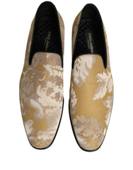 Side profile of Dolce & Gabbana gold jacquard loafers showcasing the intricate floral pattern and low stacked heel.