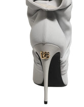 Dolce & Gabbana gray stretch knit sock ankle boots with high stiletto heels, front view on a white background.