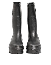 Dolce & Gabbana men's metallic black pull-on rain boots in a sleek PVC and leather blend, front view.