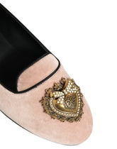 Dolce & Gabbana Devotion loafers in pink velvet featuring a gold-tone sacred heart embellishment on the front.
