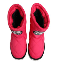 Side profile of Dolce & Gabbana pink padded boots showing the voluminous silhouette and contrast white trim.