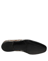 Dolce & Gabbana men's slip-on loafers featuring white and gold sequins with a refined leather trim and crest detail.
