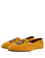 Close-up of the gold thread crown embroidery on the yellow velvet upper of these luxury Dolce & Gabbana shoes.