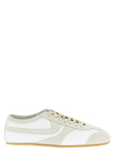 Dries Van Noten beige cowhide low top sneakers featuring a minimalist silhouette and tonal lace-up closure.