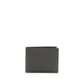 Ferragamo men's bifold wallet in smooth black Bos Taurus calf leather with discreet embossed logo detail.