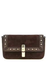Front view of a Furla brown calfskin crossbody bag featuring a structured silhouette and gold-tone hardware.