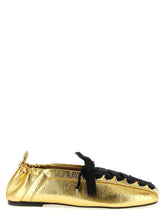 Ganni gold polyethylene ballet flats with a metallic finish and square toe, presented in a classic front view.